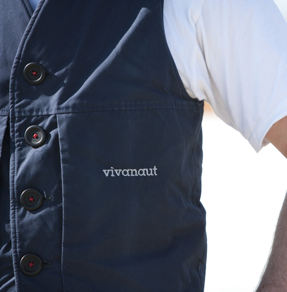 Welsh rarebit vest in blue with button and logo detail